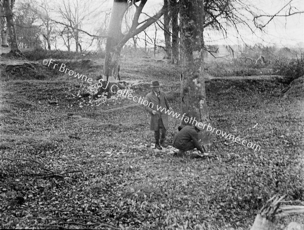 MAN & WOMAN MEASUREING TREE